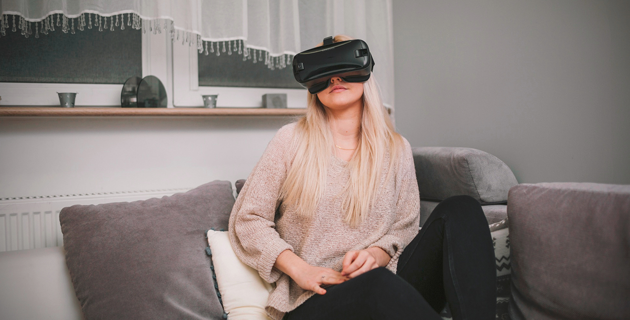 A woman immersed in a virtual reality experience, wearing a sleek VR headset, showcasing modern technology in action