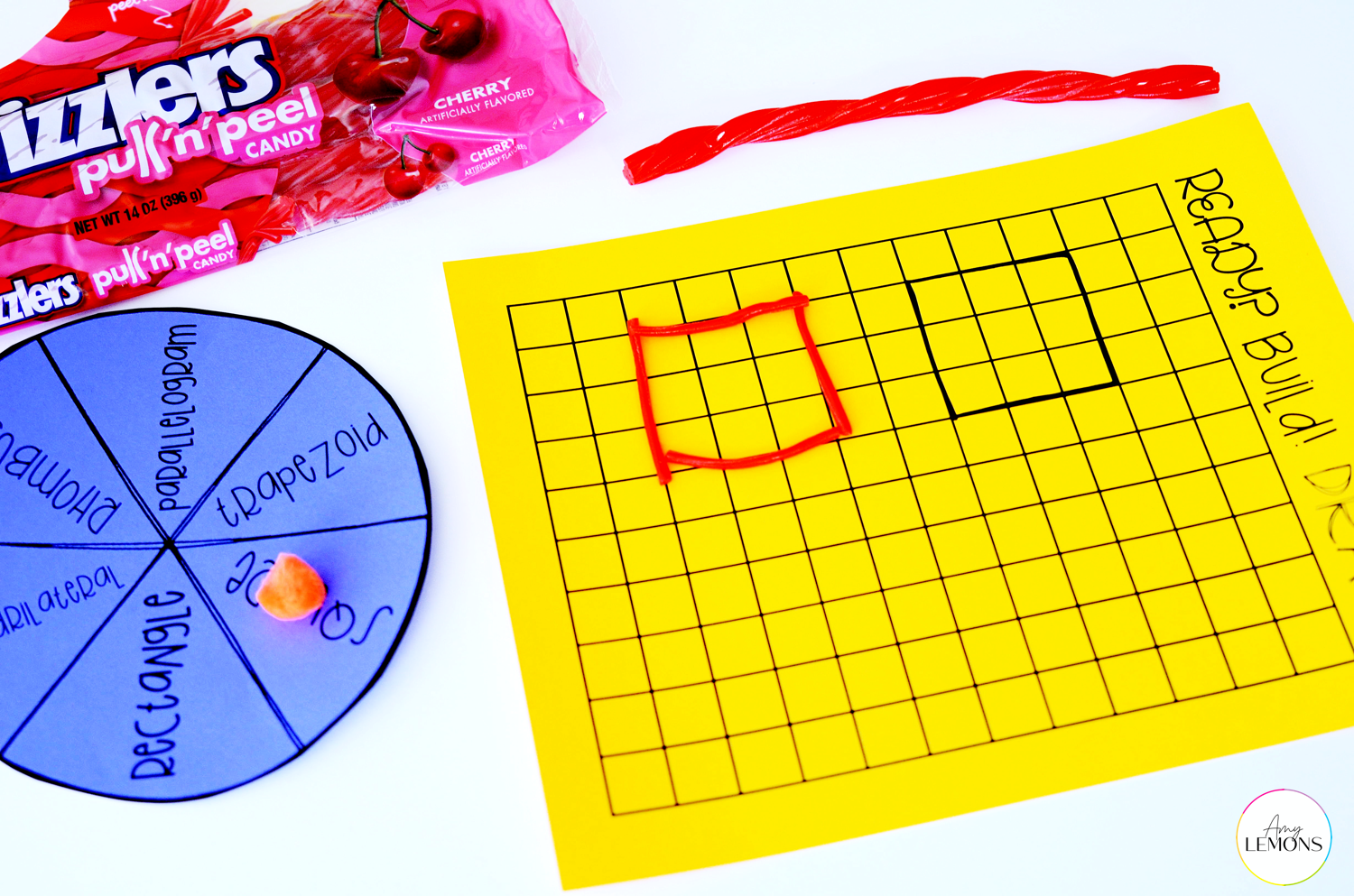 Quadrilateral building activity sheet with spinner and twizzlers as manipulatives.