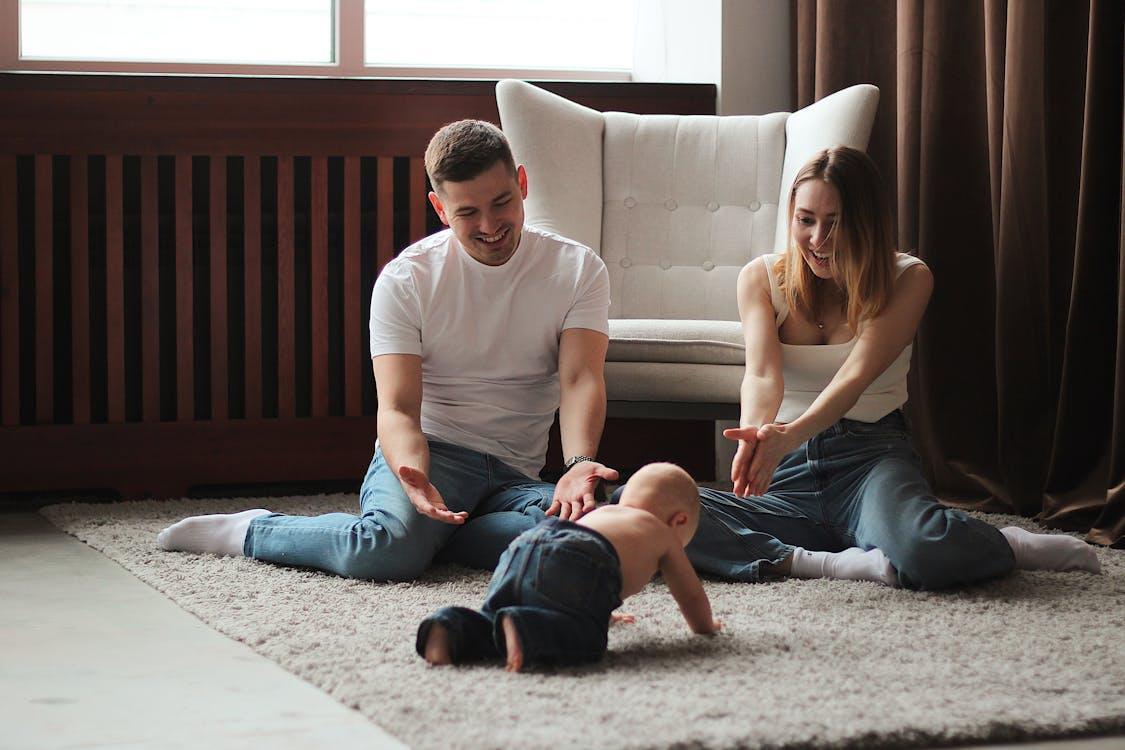 Free Parents Playing With Baby Stock Photo