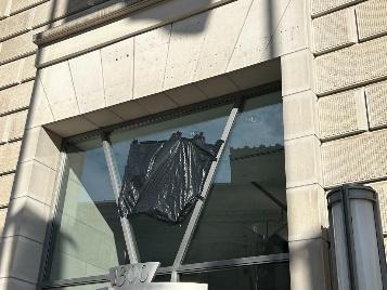 A window with a black plastic bag on it

AI-generated content may be incorrect.