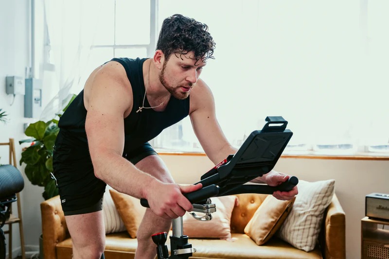 Man using the SOLE SB900 Exercise Bike.