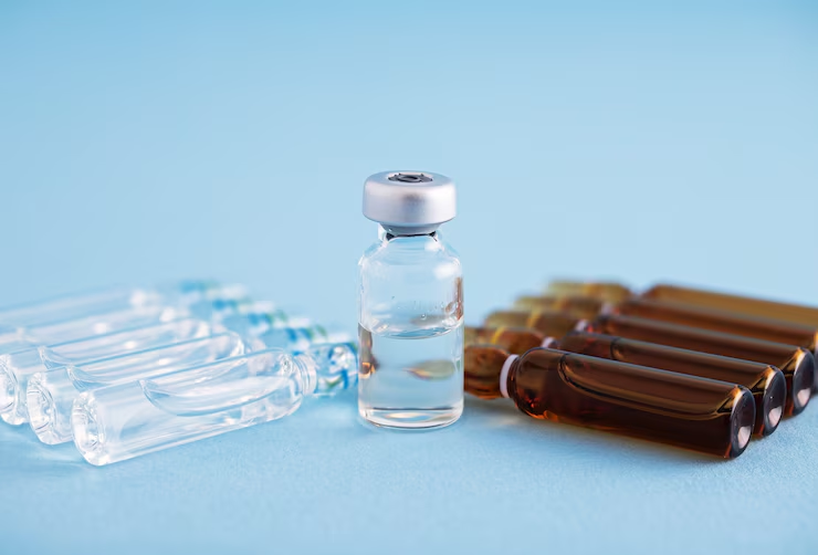 clear-vial-with-liquid-standing-between-glass-ampoules-and-brown-vials-on-blue-background-pancragen-and-the-liver-the-organeless-stack-combo-thats-fixing-insulin-resistance-tony-huge