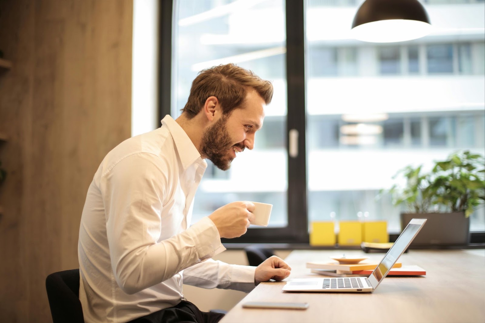 image of a man on his laptop