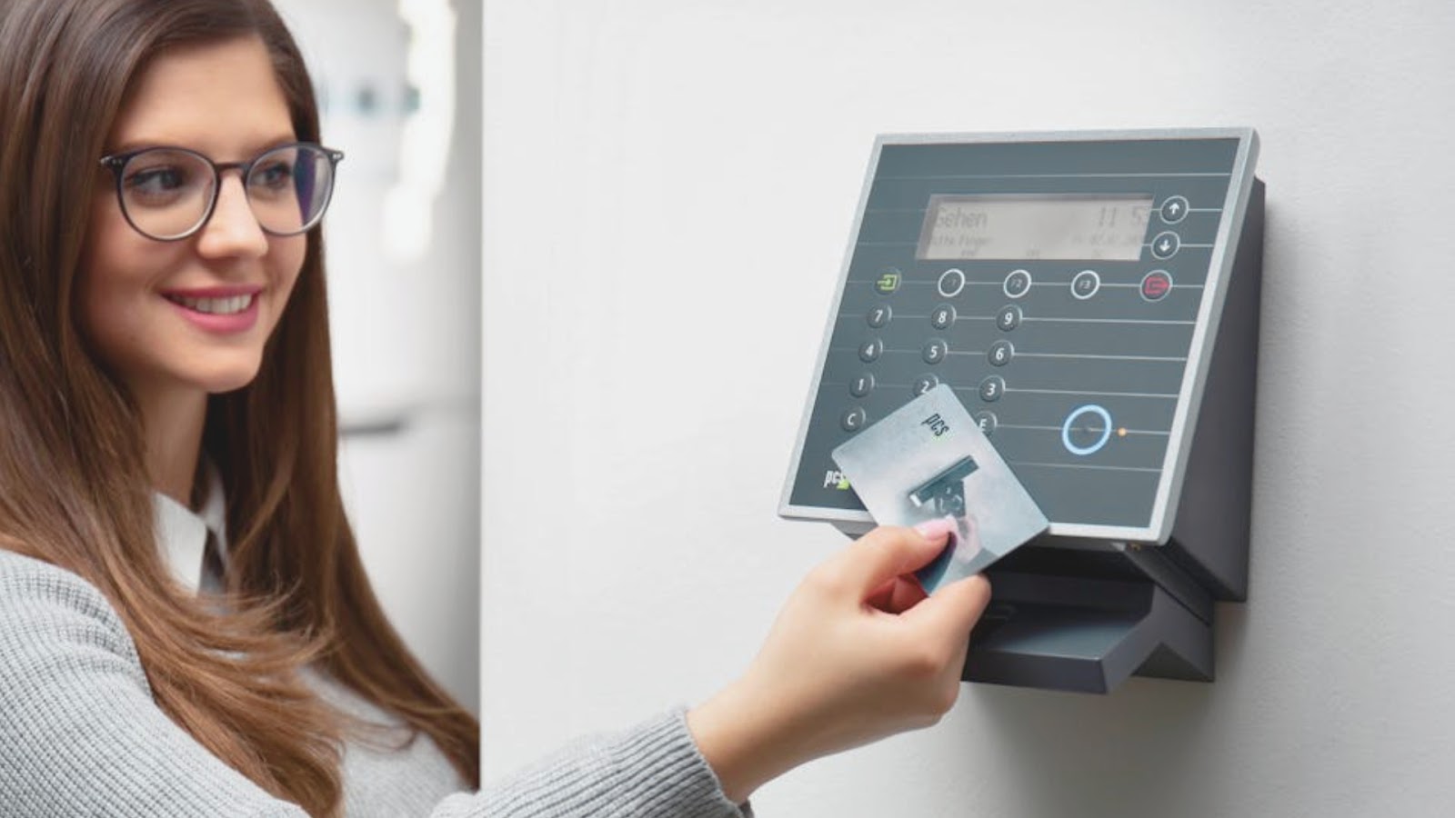 Office worker unlocking a door with a smart lock system