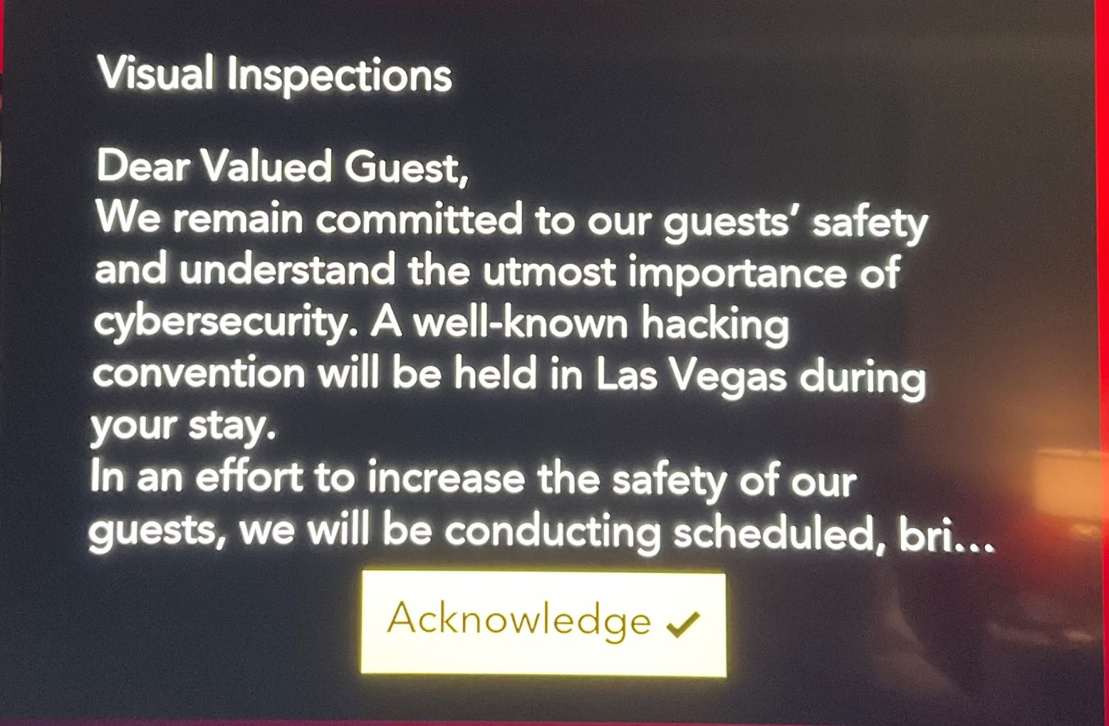 A photo of a message on a television that read "As you may or may not know, a well-known hacking convention will be held in Las Vegas during your stay."