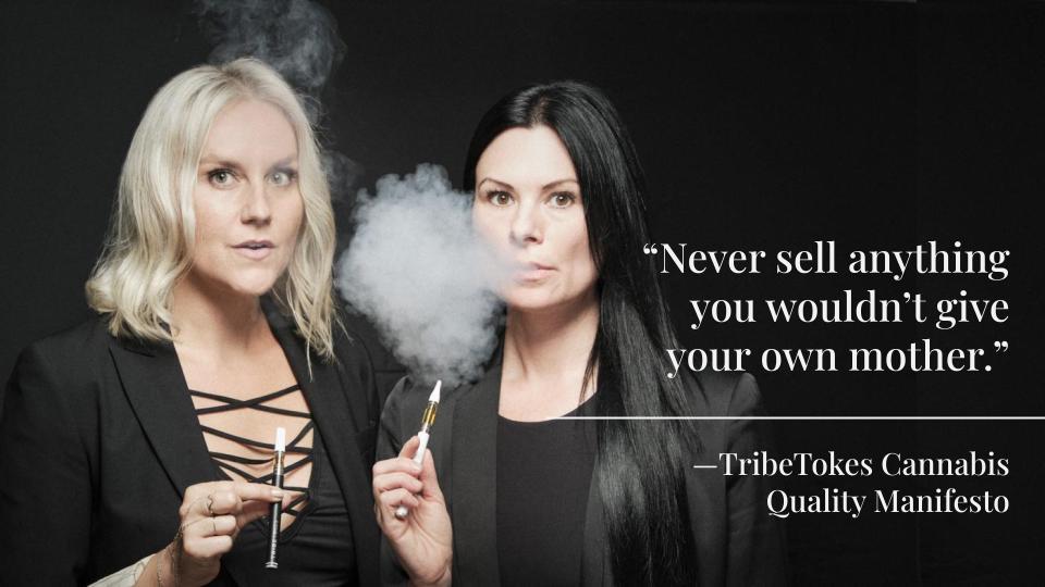 two ladies smoking vapes 