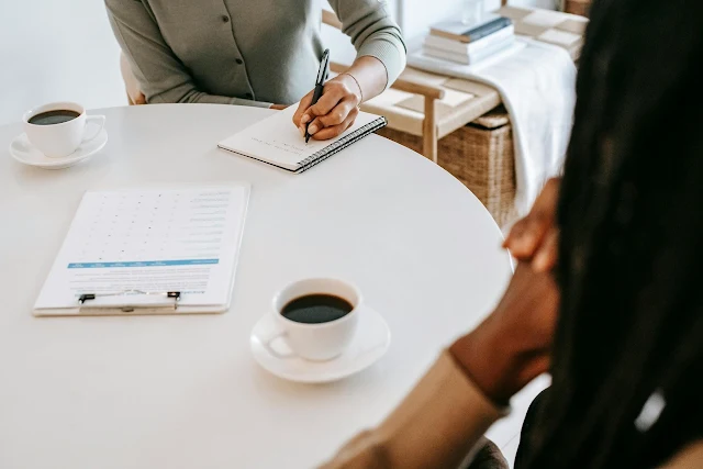 interviewer writing in note book