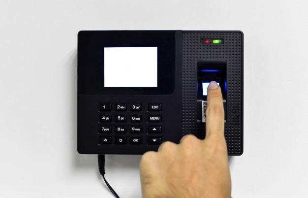 A fingerprint scanner on a machine

Description automatically generated