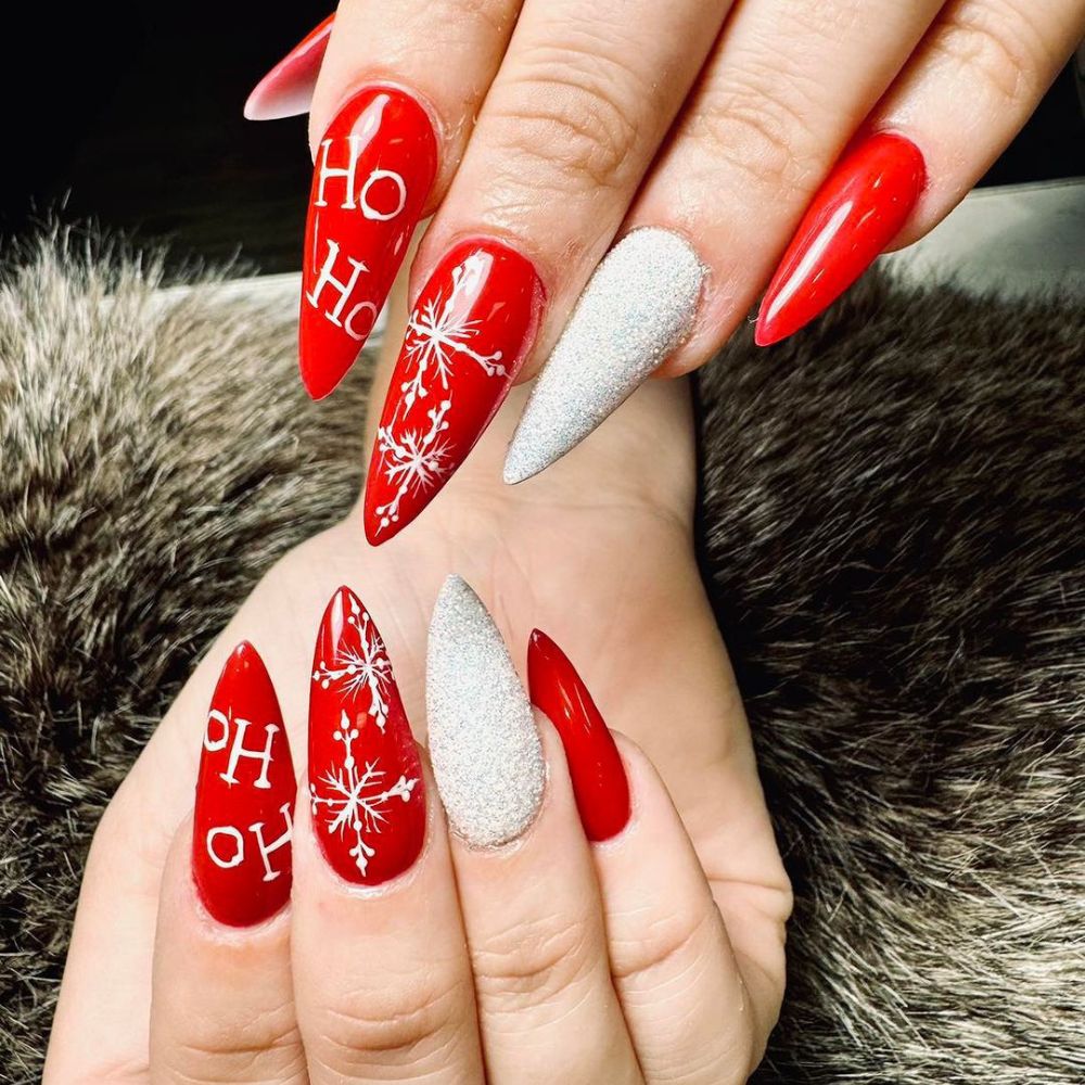 Close up of hands having Christmas red nails with Short Christmas Nails