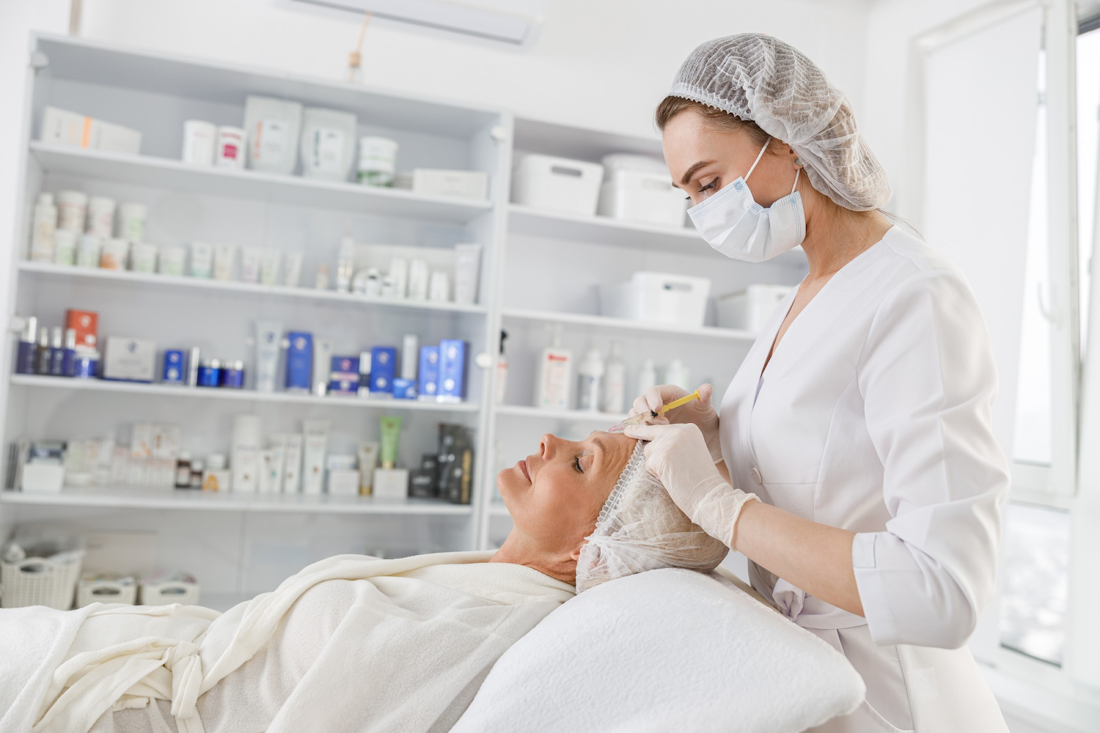 Dermatologist treating a patient