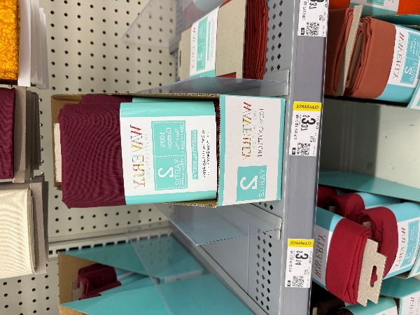 A shelf with a stack of blankets

AI-generated content may be incorrect.
