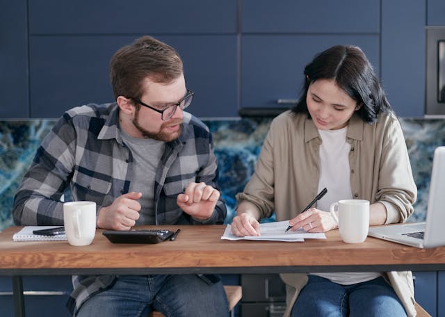 Two poeple doing taxes