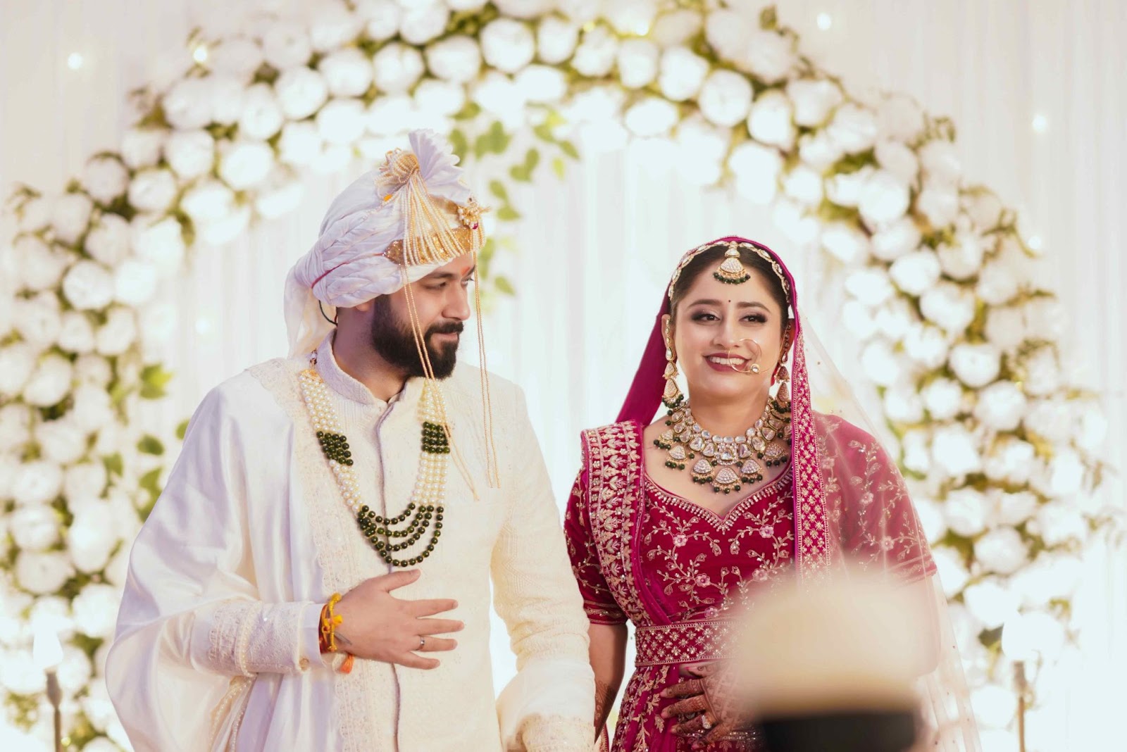 The groom cherishes the moment, watching his bride, a perfect shot for 2025 wedding photography