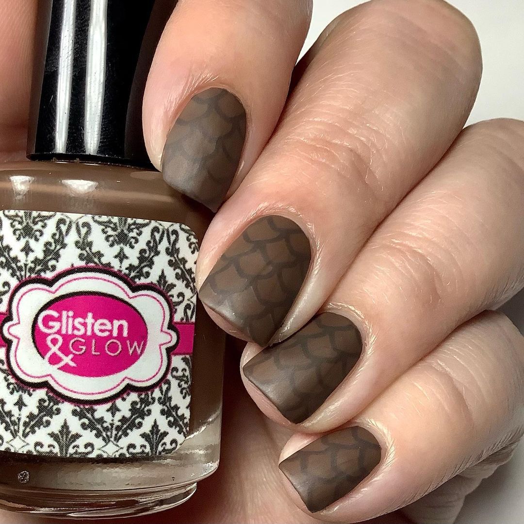 Close-up of hands with fall nail design having Acorn and Pinecone Accents