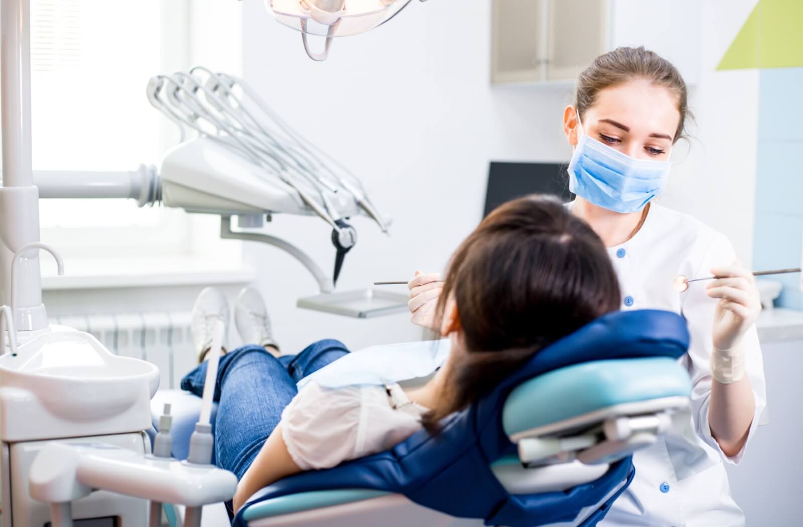 A dentist performing a routine exam.