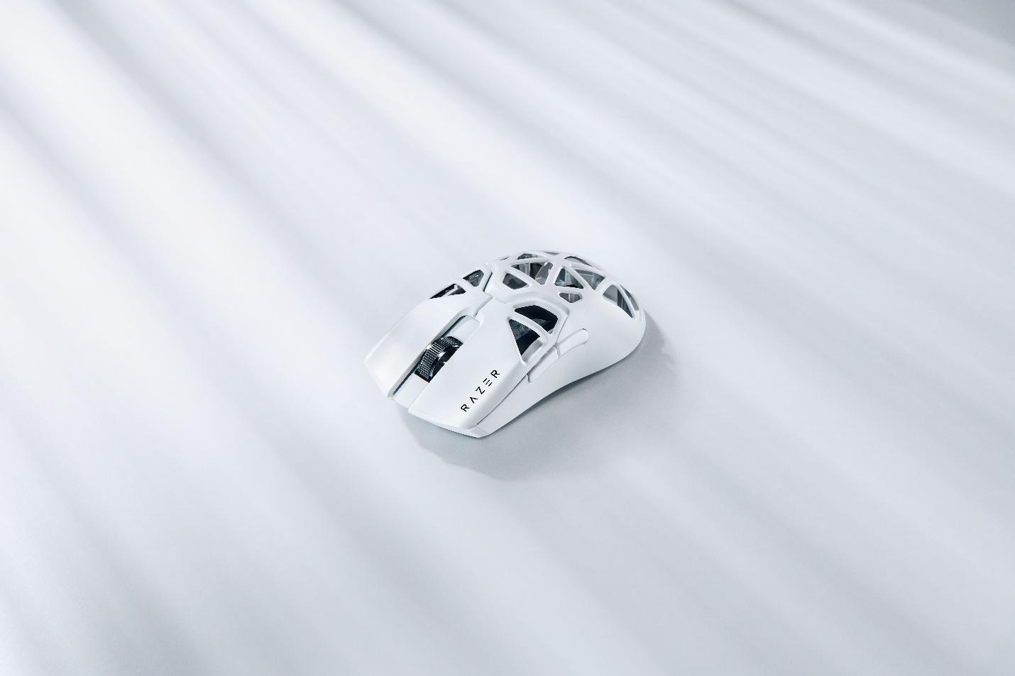 A computer mouse on a white surface

Description automatically generated