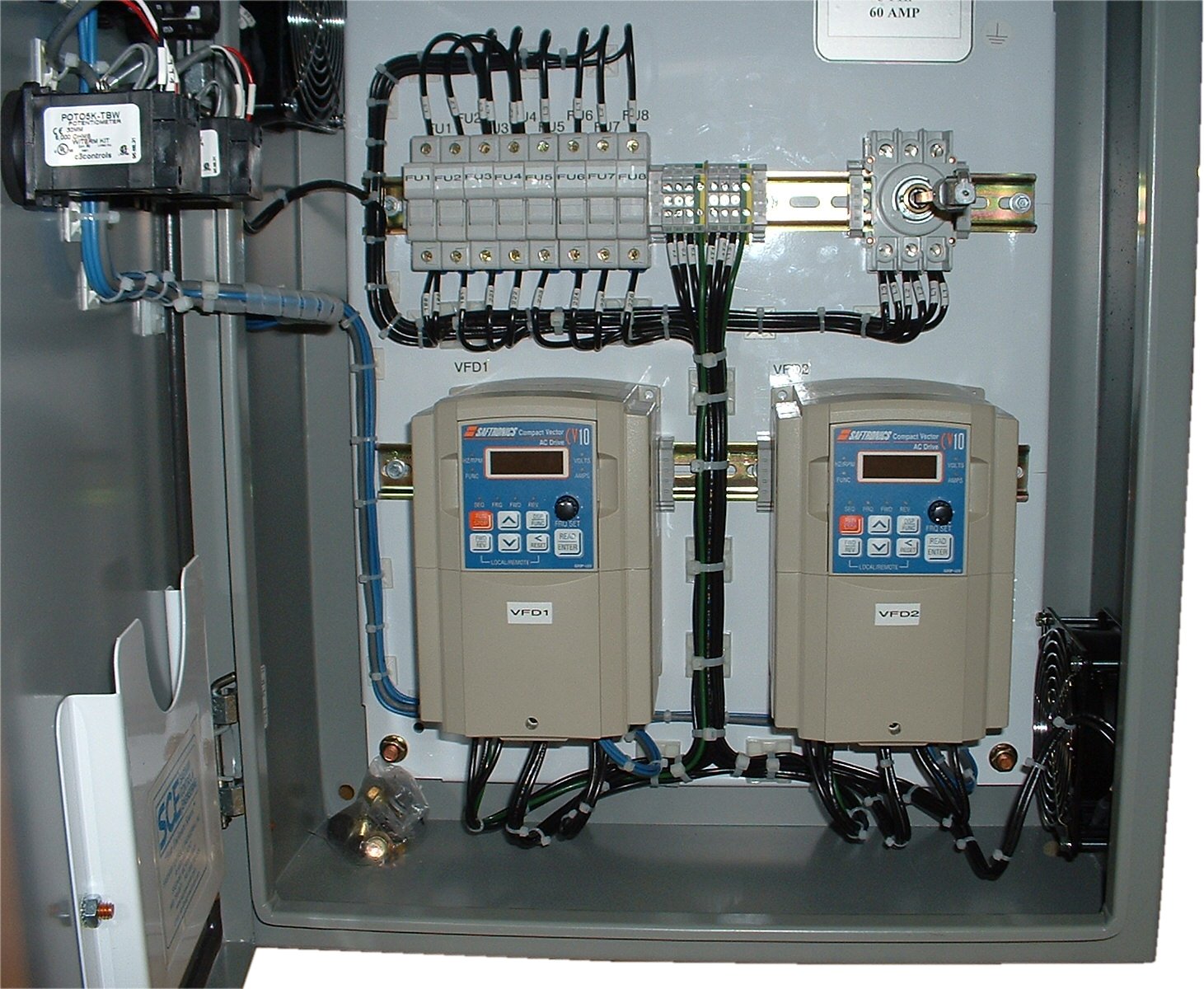 A pair of variable frequency drives mounted to a wall.