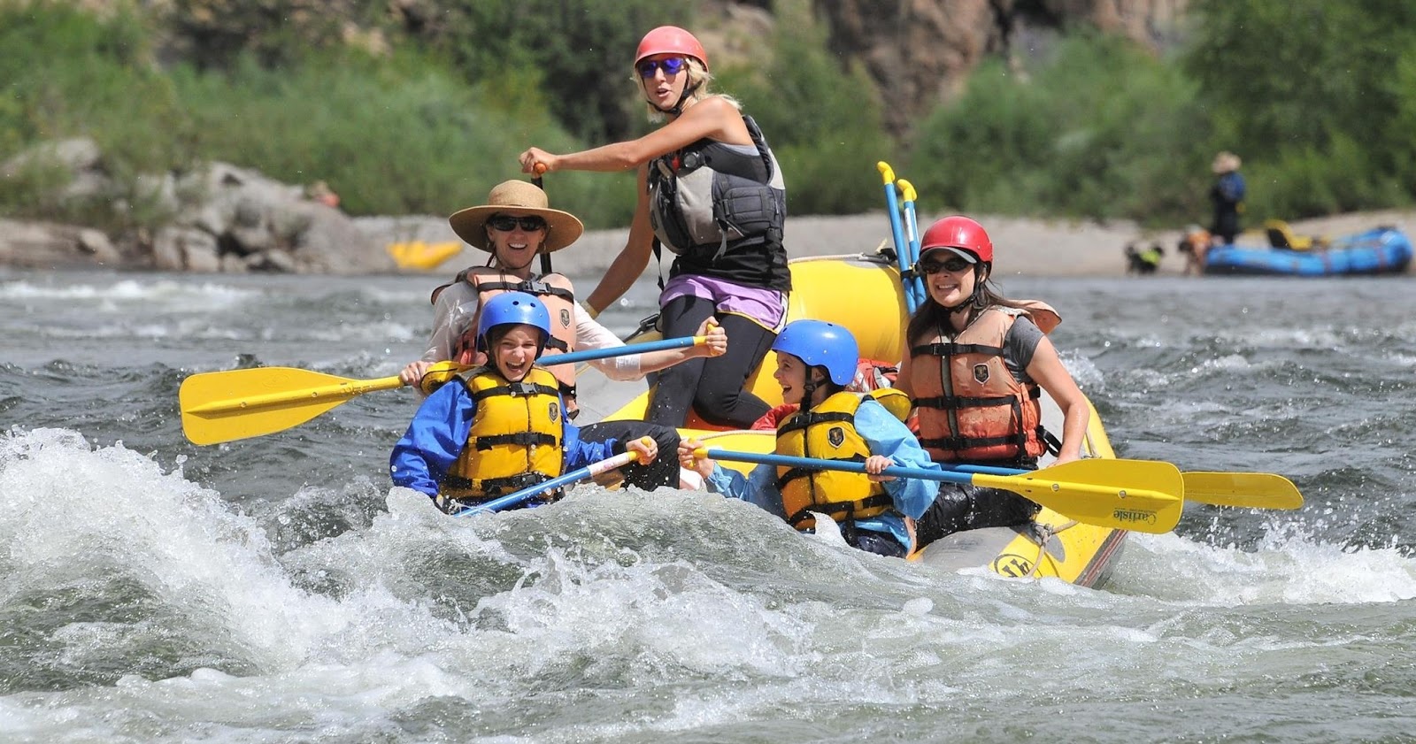 a man riding on a raft in the water