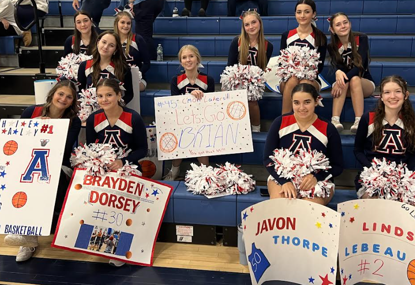 image of cheerleaders with signs