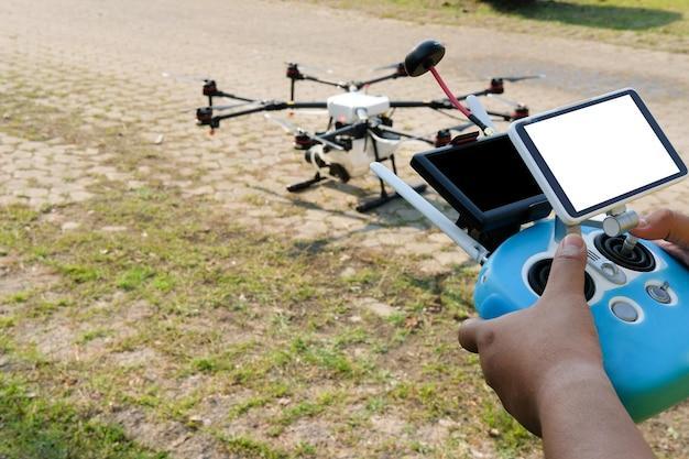 Man photographing with mobile phone on field