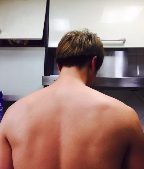 This contains an image of BTS Jin broad shoulders