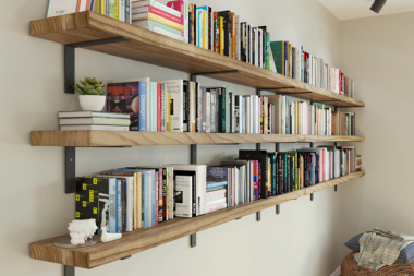 stylish living room storage ideas wood floating shelves with books and succulents custom built michigan