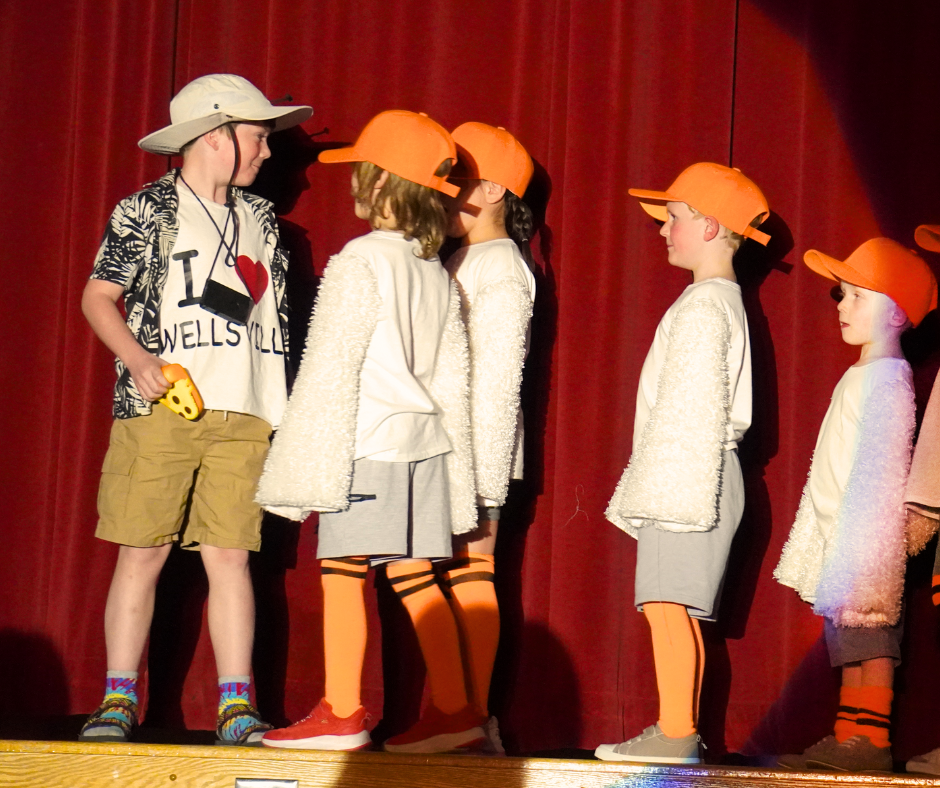 Students dressed as seagulls performing in the elementary musical Finding Nemo.