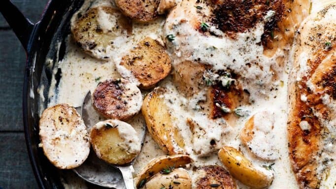 Dutch Oven Creamy Ranch Chicken & Potatoes in a cast iron skillet.