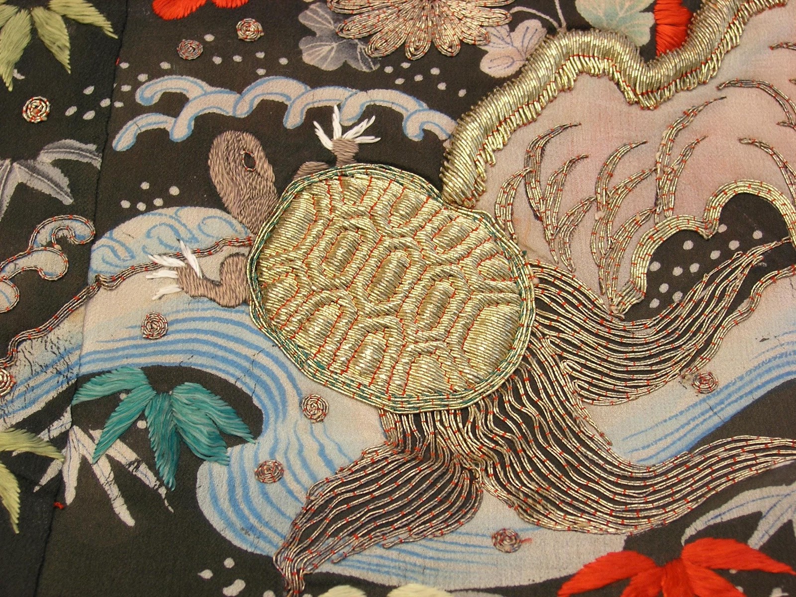 A close-up of a fabric with a turtle

Description automatically generated