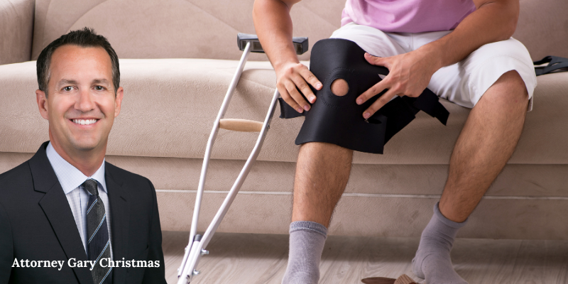 Personal Injury Lawyer Gary Christmas in front of an injured victim
