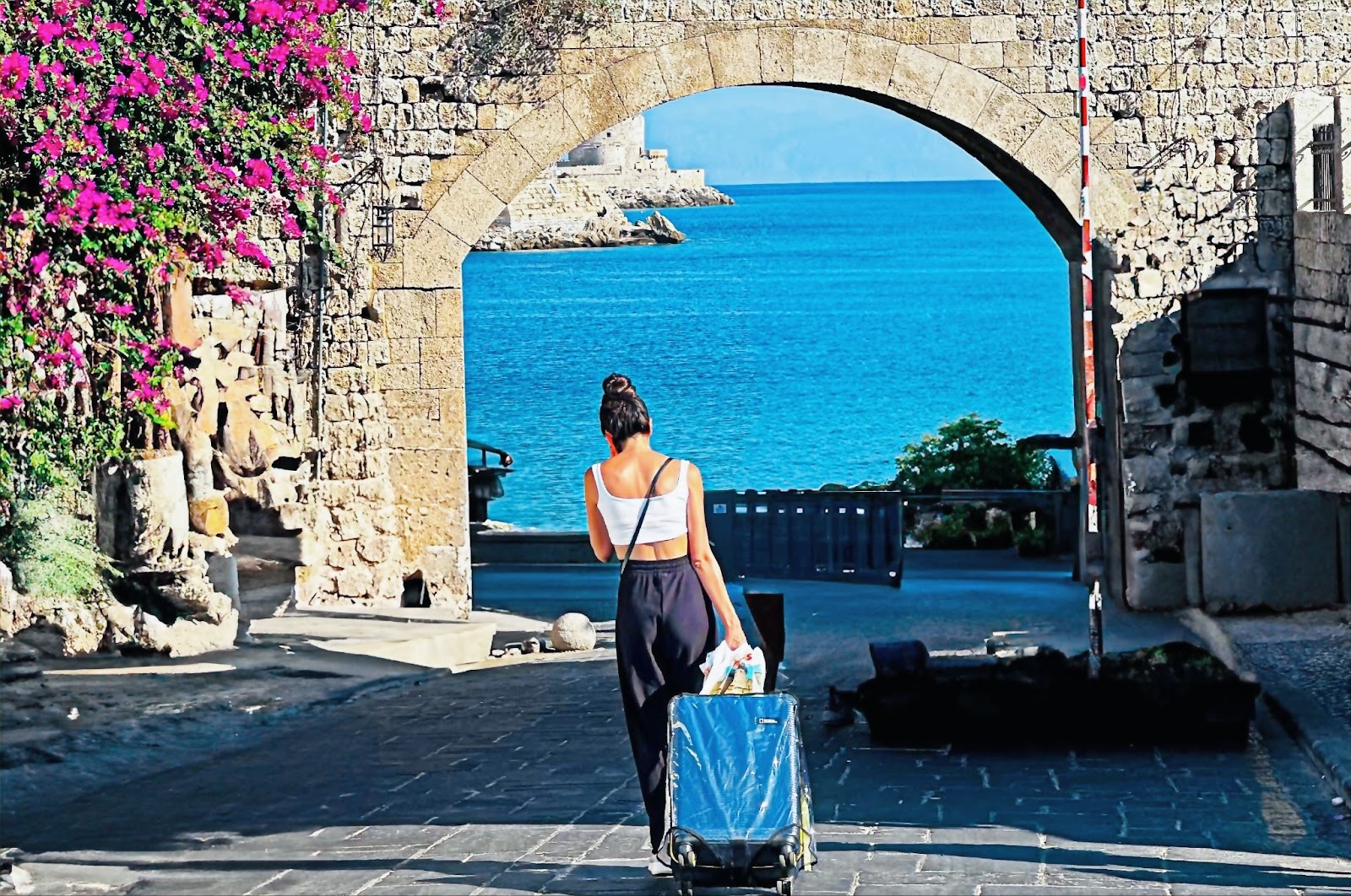 Rhodes Old Town, woman with her luggage