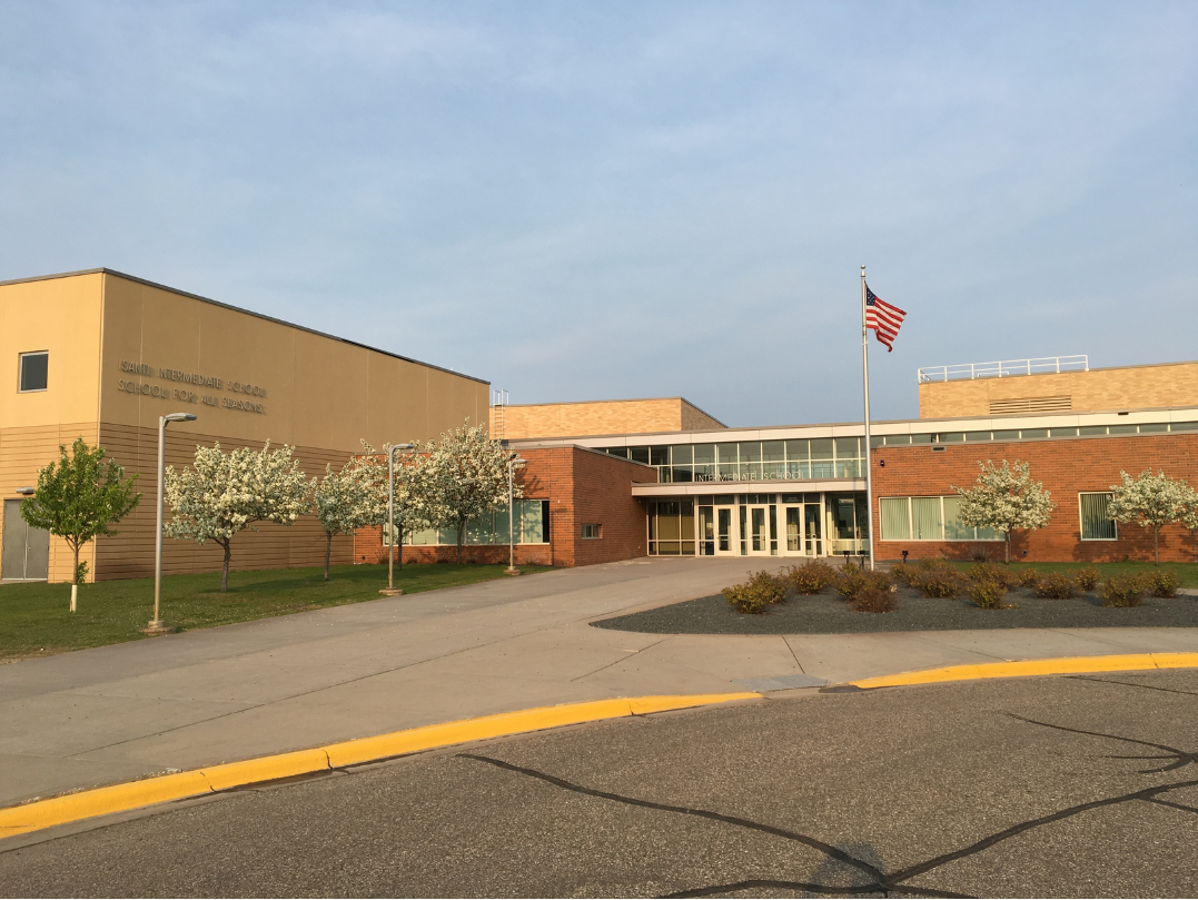 Exterior of a public high school building on a sunny day