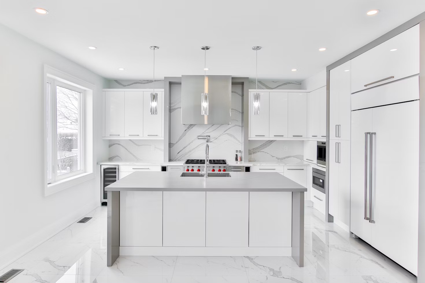 a beautiful kitchen with sunlight streaming in through clear windows