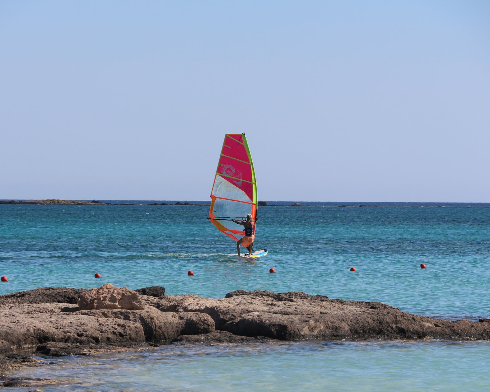 A man windsurfing.