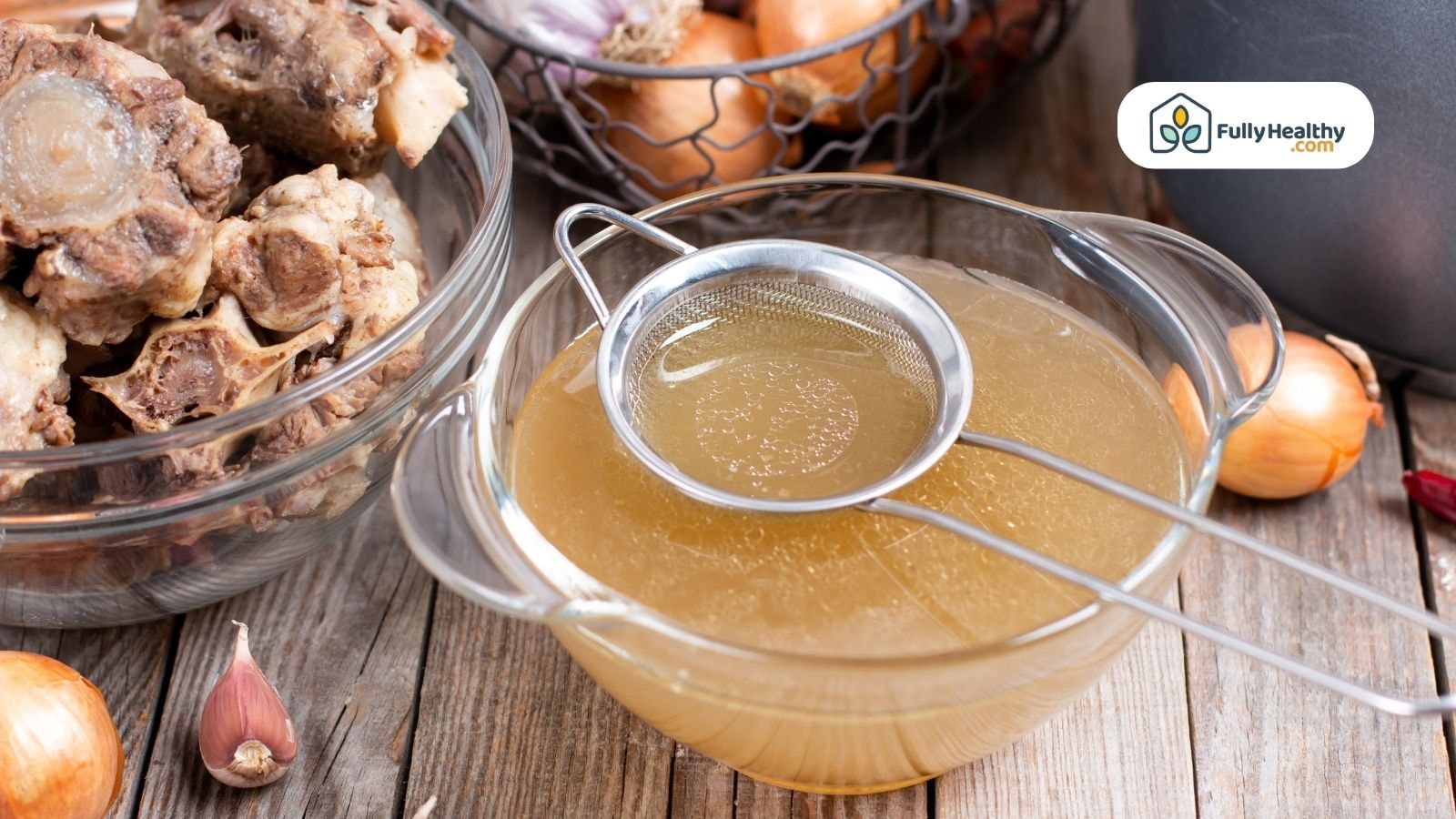 Straining fresh beef broth with bones and onions on wooden surface