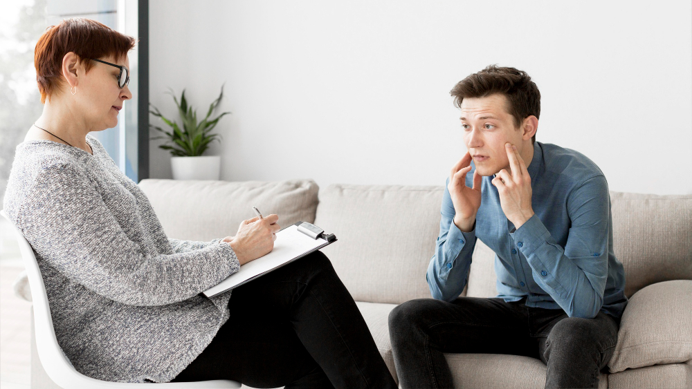 A therapist trying to establish the link between genetics and OCD during a session with her patient.