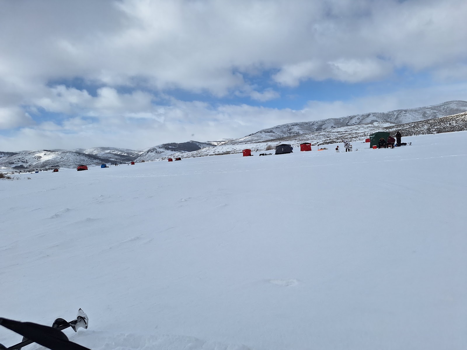 The sight of all the tents out ice fishing at Scofield Reservoir, part of the 2025 kokanee tour of Utah