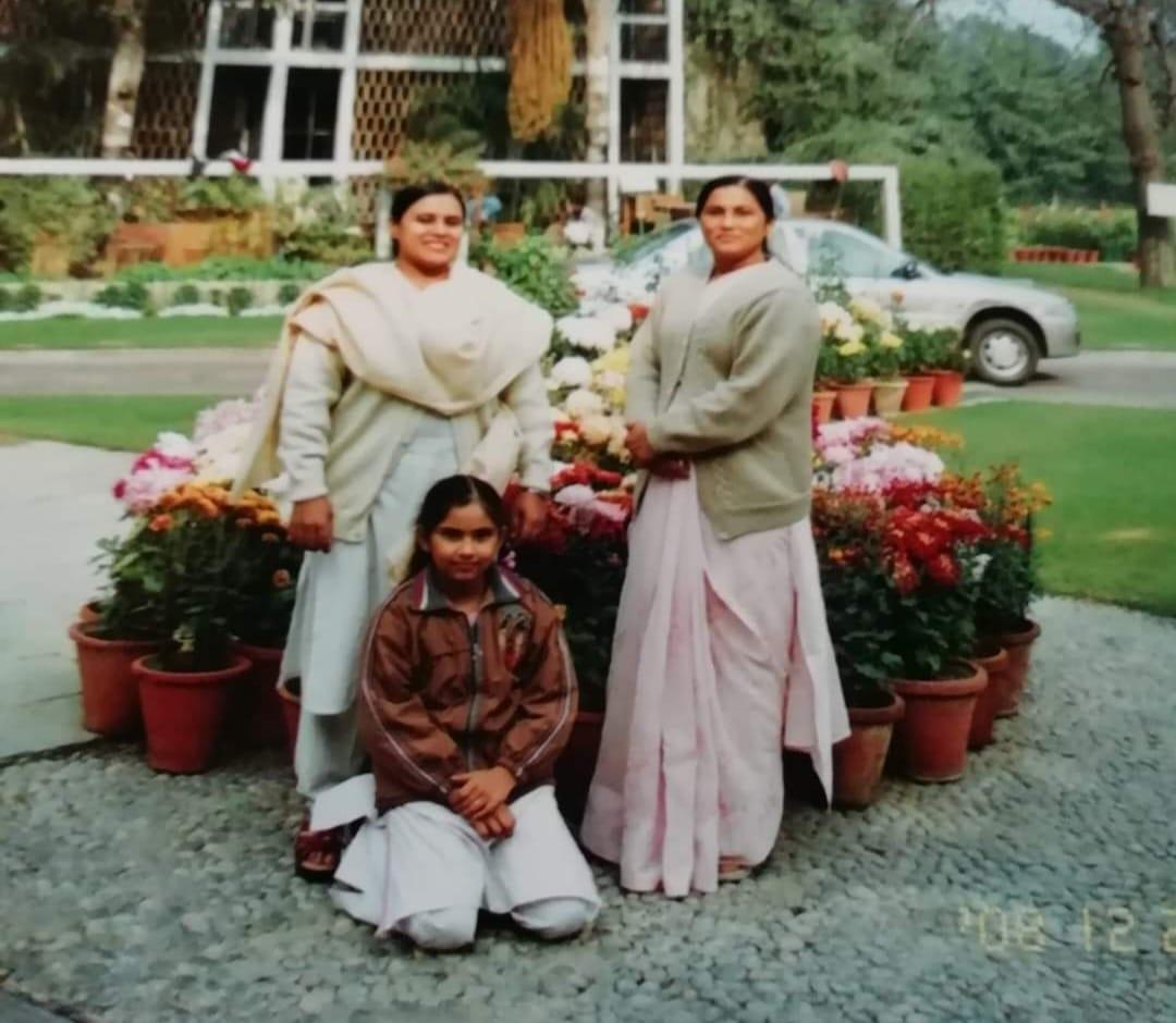 A group of women posing for a picture Description automatically generated