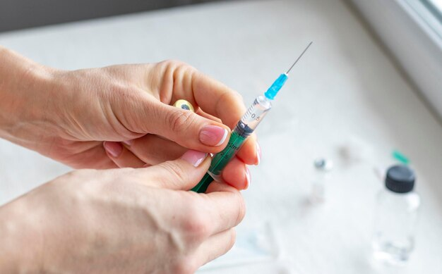 a-person-holding-a-syringe-filled-with-liquid-preparing-for-an-injection-on-a-white-surface-with-vials-in-the-background-why-every-high-performer-i-know-is-secretly-injecting-thymogen-tony-huge