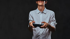Young Teenager Dressed White Shirt Wears Virtual Reality Glasses Controls Quadcopter Using Control Remote