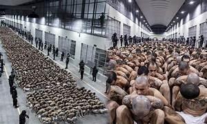 A large group of people in a prison

AI-generated content may be incorrect.