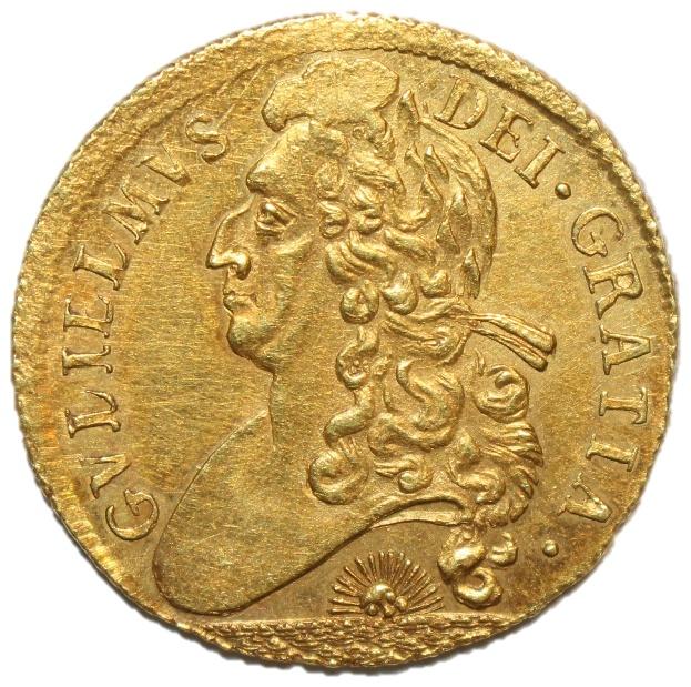 A gold coin with a person's face

Description automatically generated