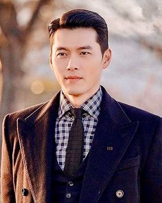 A picture of Hyun Bin  on a black suit 