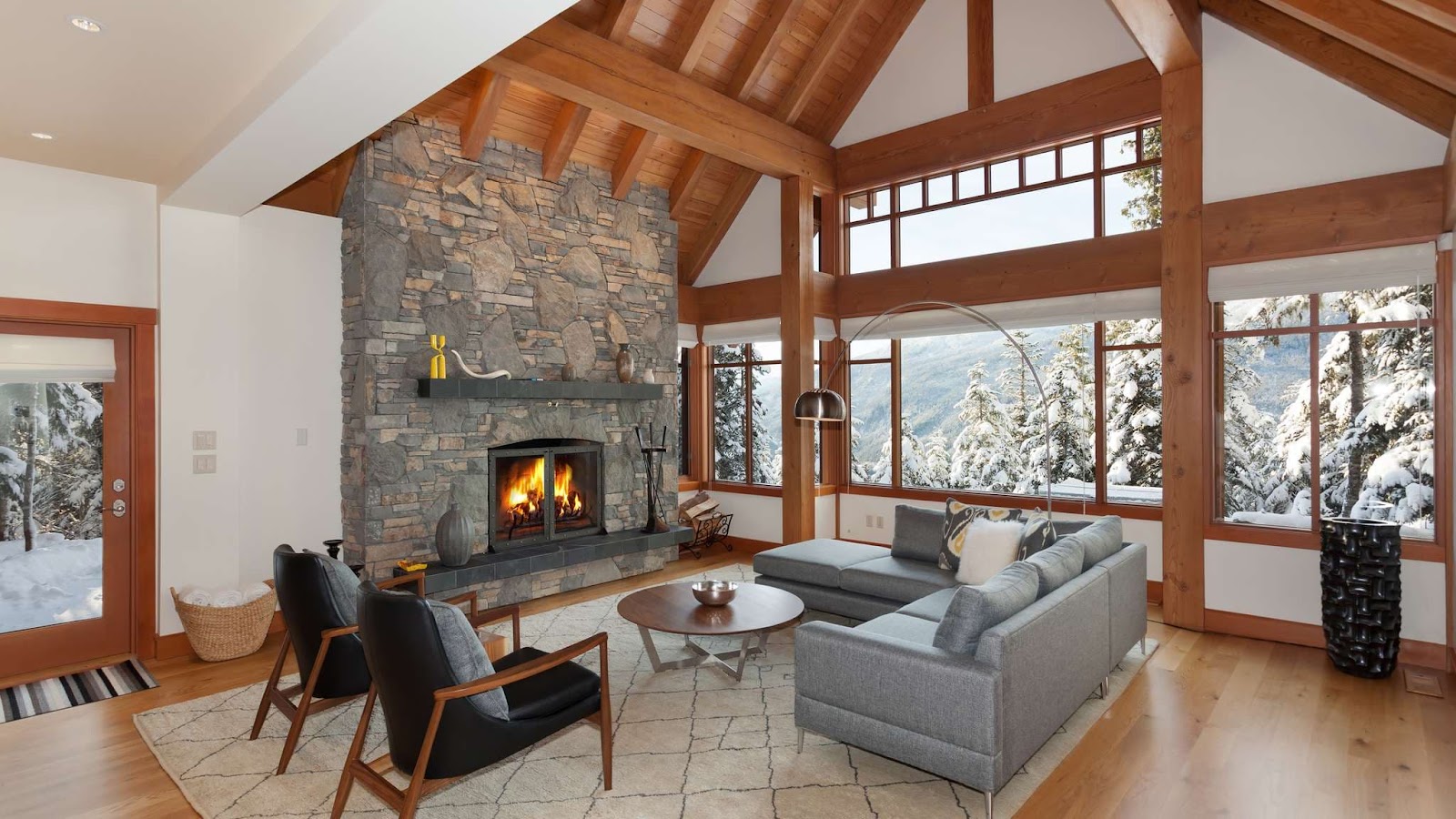 Luxury ski-in ski-out chalet in Whistler with stone fireplace and wooden beams