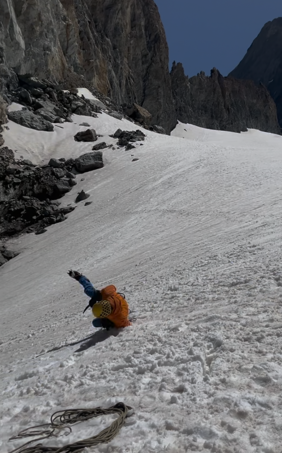A person falling down a snowy mountainAI-generated content may be incorrect.