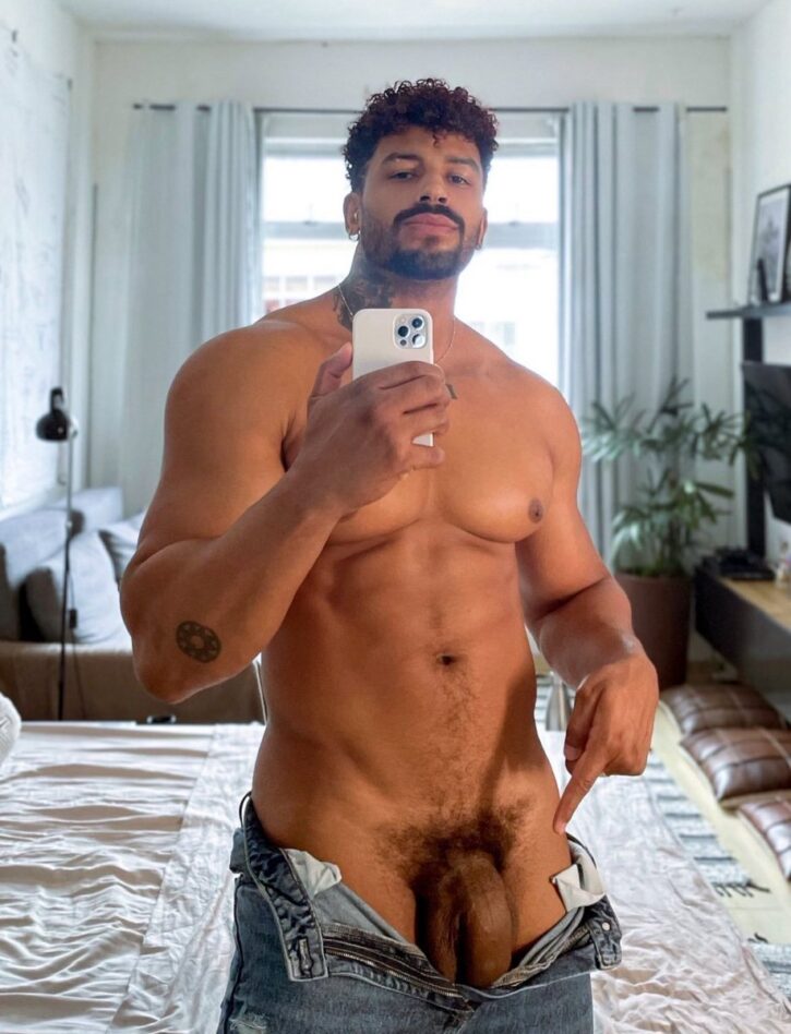 Lipe Scorpio posing for iphone mirror selfie with his thick flaccid dick peeking out of his unbuttoned denim blue jeans