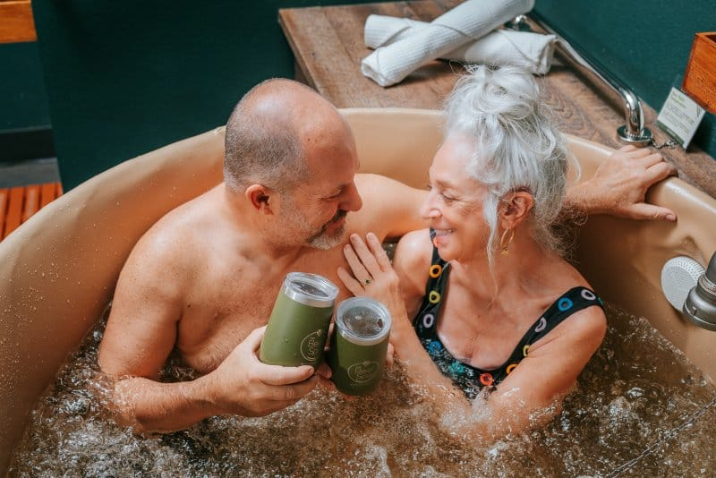 Couple enjoying beer bath hydrotherapy at Oakwell