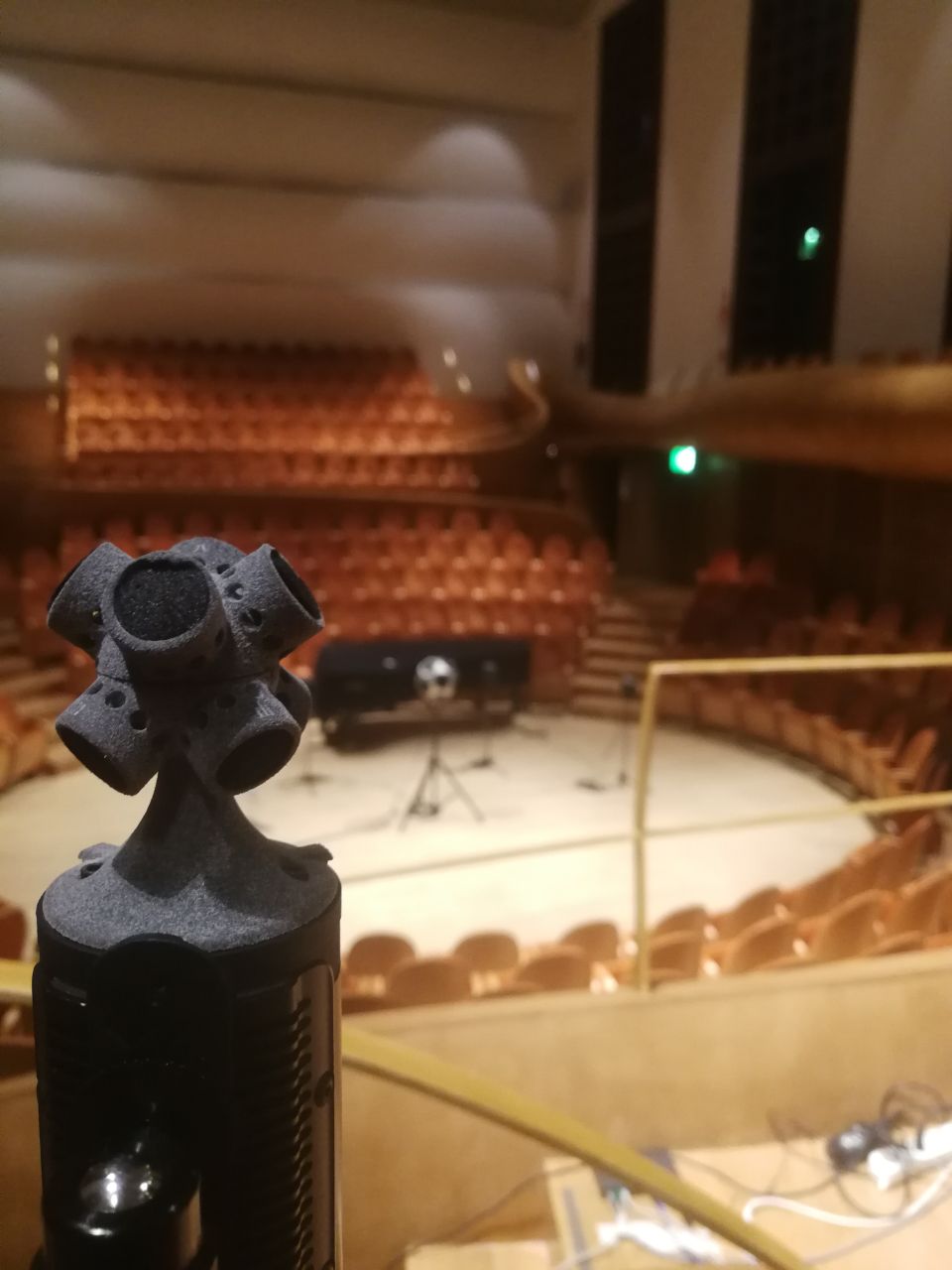 Sneak peak of the ambisonics microphones used to capture sound from all directions, providing a comprehensive audio recording of the concert venue (AI-driven models)