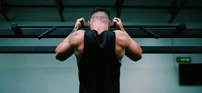 Man performing a pull up.