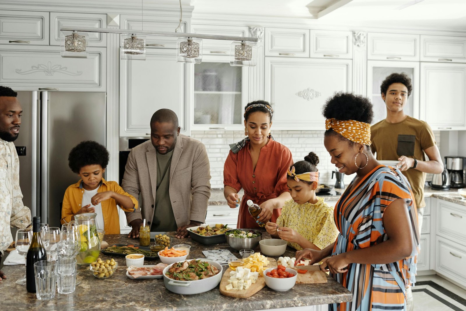 A happy family preparing a meal in the kitchen